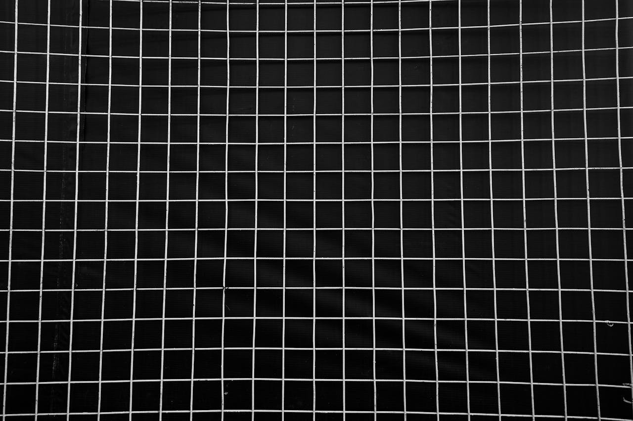 Crafting Captivating Headlines: Your awesome post title goes here Black and white geometric grid pattern creates a textured background.